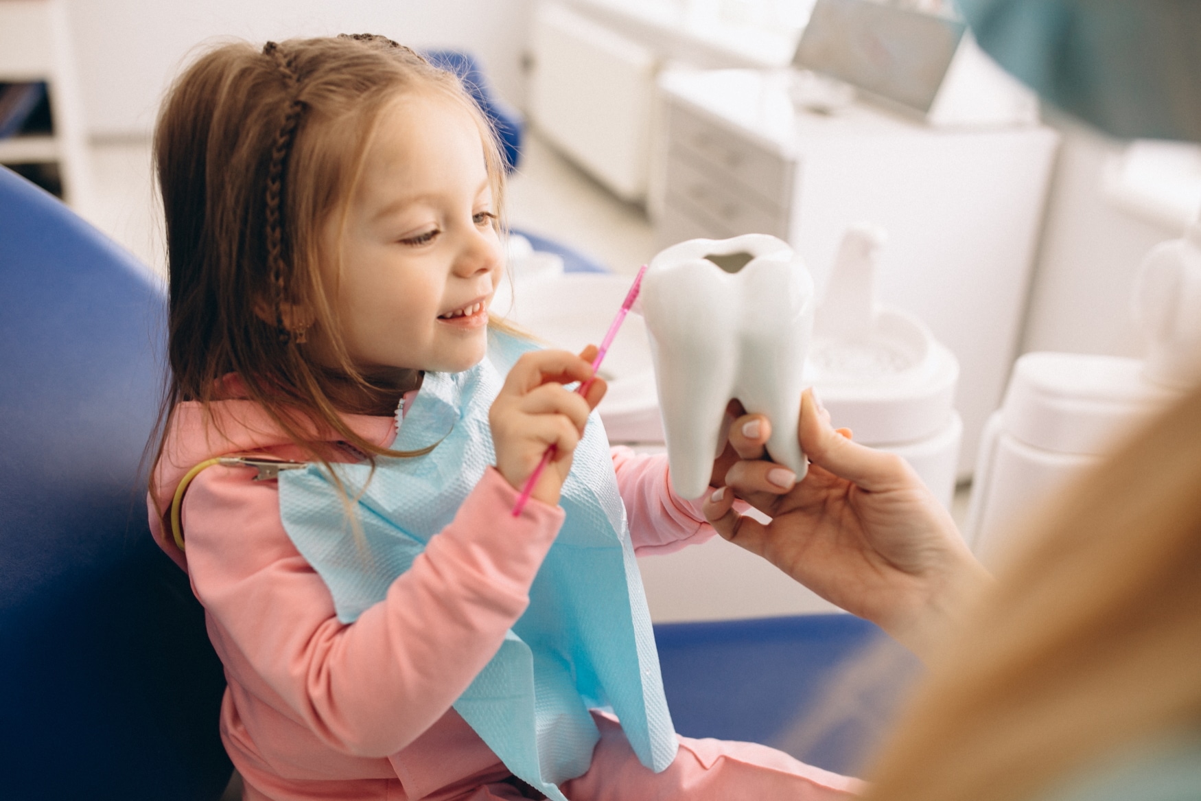 Little girl at pediatric dentist