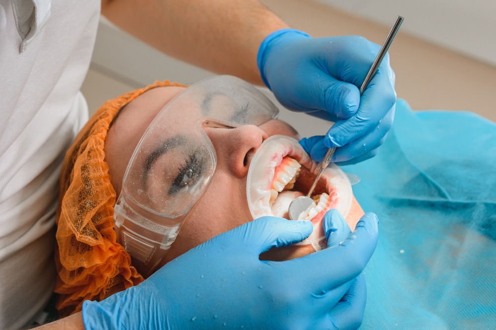 dentist working on full mouth rehabilitation