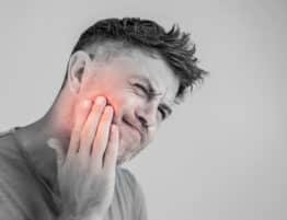 Toothache, medicine, health care concept, Teeth Problem, young man suffering from tooth pain, caries